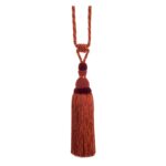Amber Orange Swish Moulin curtain tieback with a corset design and tassels.