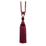 Red Swish Moulin curtain tieback with a corset design and tassels.