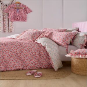 Cath Kidston Ditsy Archive Pink Bedding. A treasured archive favourite, the classic Ditsy archive print features dainty blooms in a joyful palette of red, coral, soft pink, and lilac. Printed onto soft cotton with pretty tie details on the pillows. A reversible design with pretty soft 100% cotton percale pastel colourway on the other side, choose whichever style suits your mood.