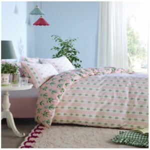 Cath Kidston Lily of the Valley Soft Pink bedset. With hand-painted bunches of Lily of the Valley that are drawn tied with a bow, an ode to friendship - a flower known to represent love, luck and joy. This crisp 180tc 100% cotton percale bed linen is backed with a graphical pink stripe reverse and has a painted Cath Kidston crest detail. 180 thread count and 100% cotton cover.